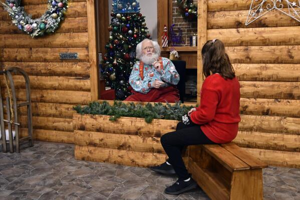 The Santa experience this year is a mix of laps distancing AP News